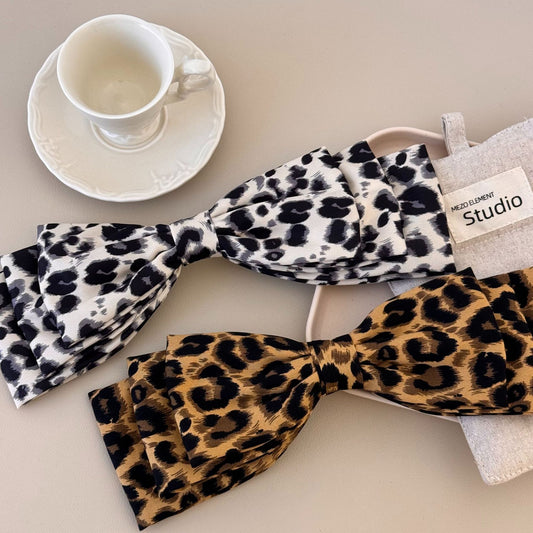 2 piece leopard print hair clips in black and white and brown and black patterns