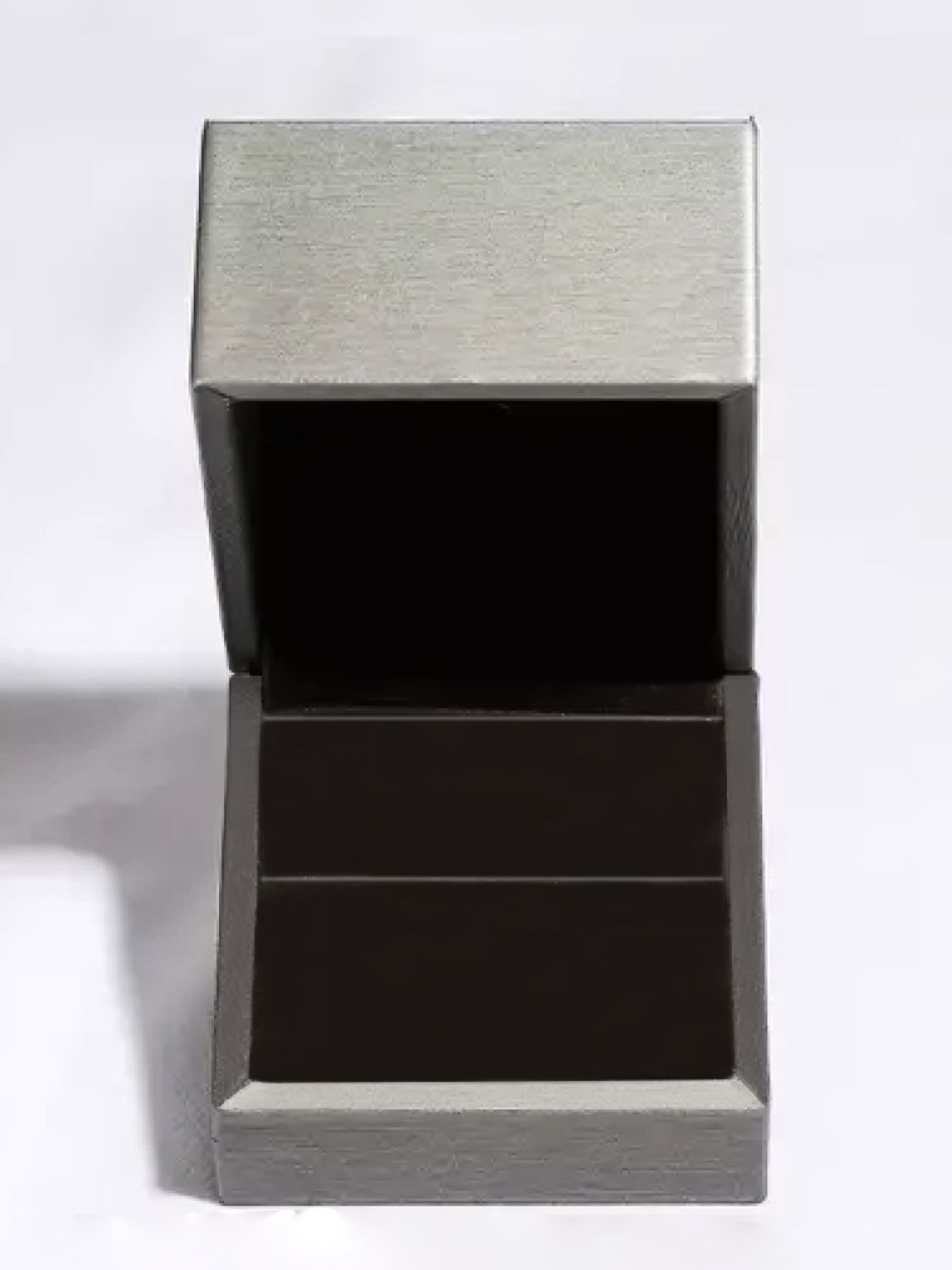 Open grey jewelry box with black velvet interior for 925 sterling silver moissanite ring