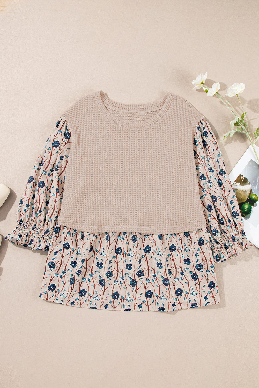 Beige faux two piece knit blouse with floral patterned sleeves and ruffled hem for plus size women