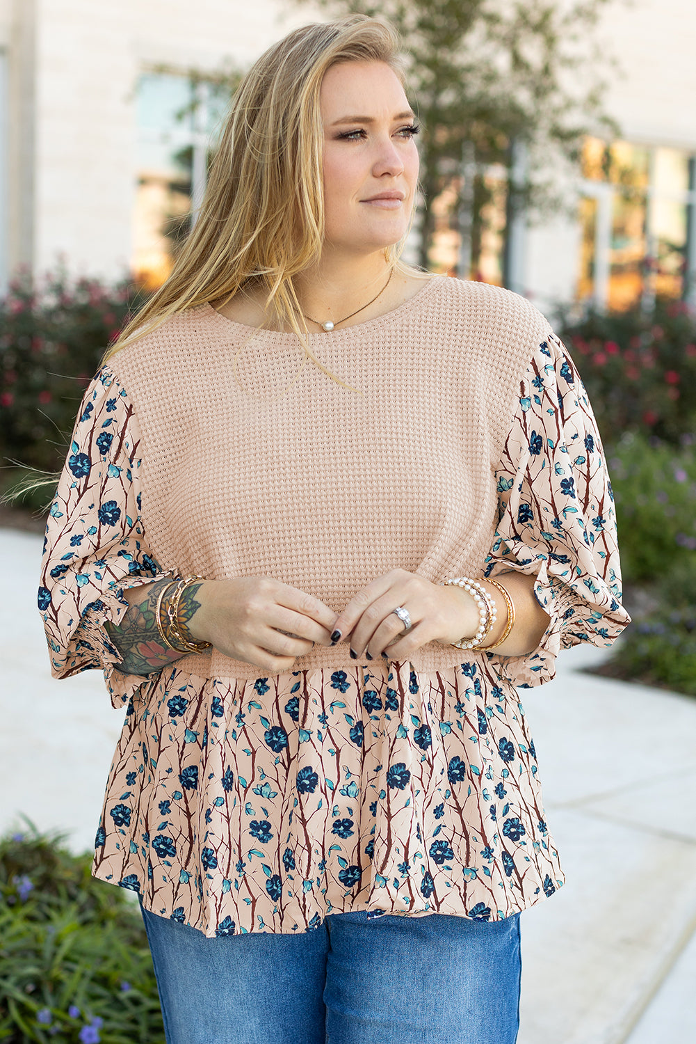 kjplussizefashion beige faux two piece knit blouse with floral sleeves worn by plus size woman outdoors