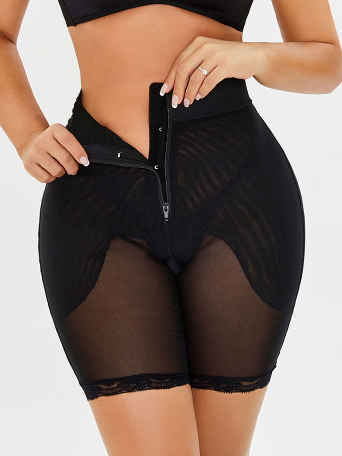 Trendsi plus size high waisted shaping shorts in black with front zipper and lace trim detailing