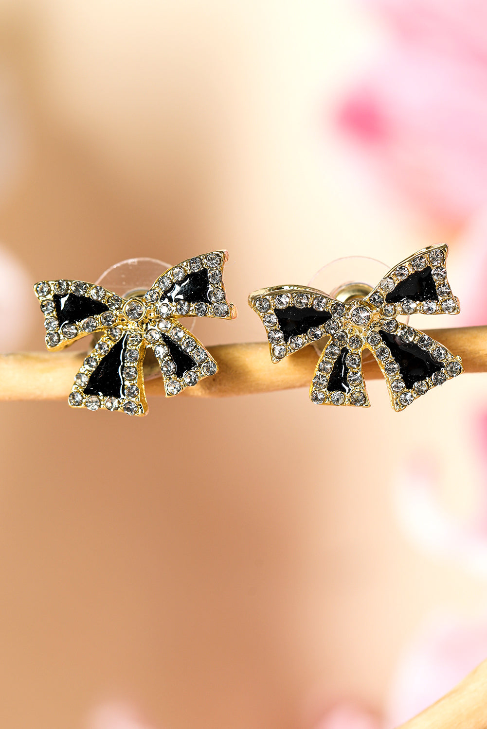 Black rhinestone bow earrings with gold trim and sparkling clear crystals from kjplussizefashion
