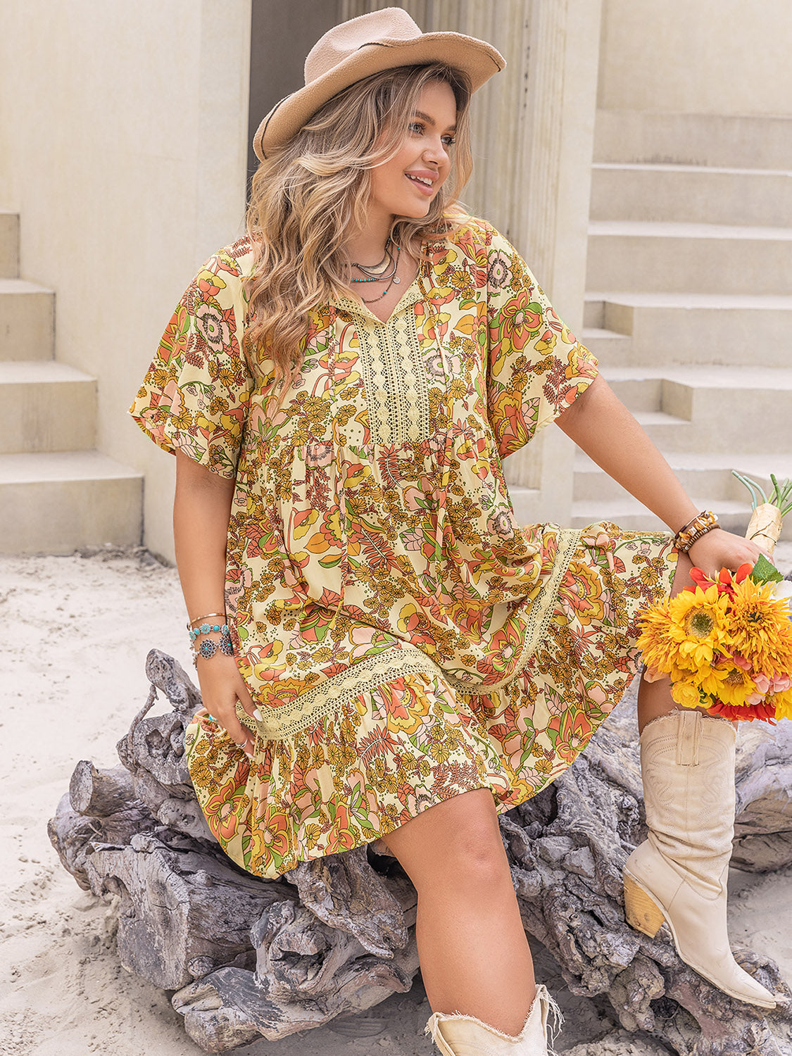 Trendsi plus size printed mini dress with floral patterns worn with beige hat and boots