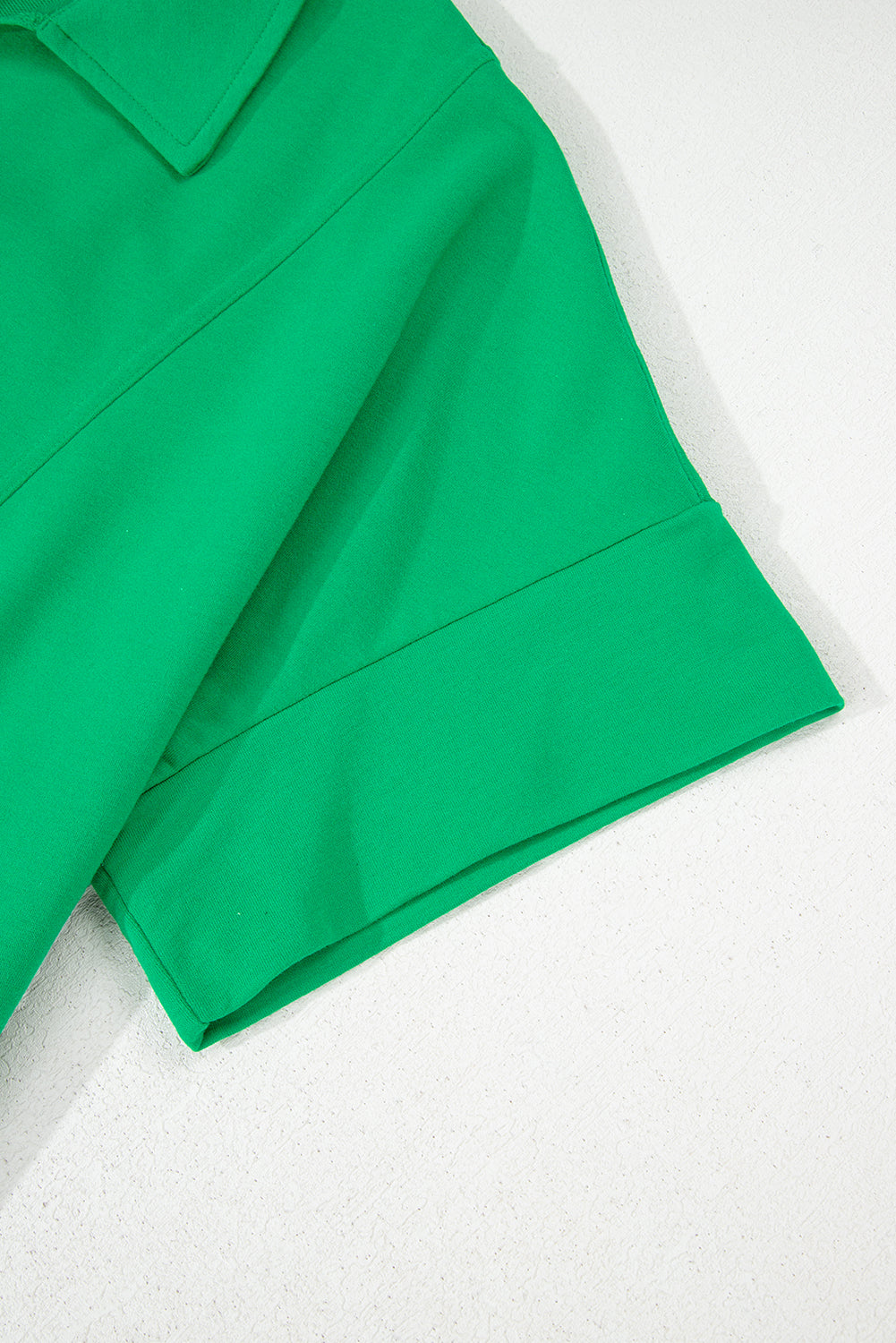 Bright green short sleeve blouse for women in plus size by kjplussizefashion with tailored sleeve detail