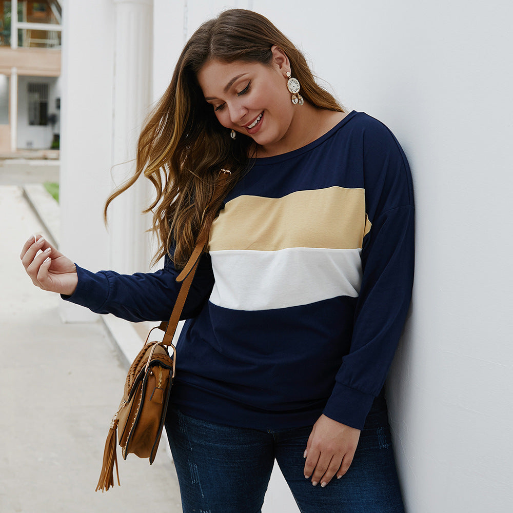 Woman wearing navy blue color blocked casual plus size tops for women with beige and white stripes