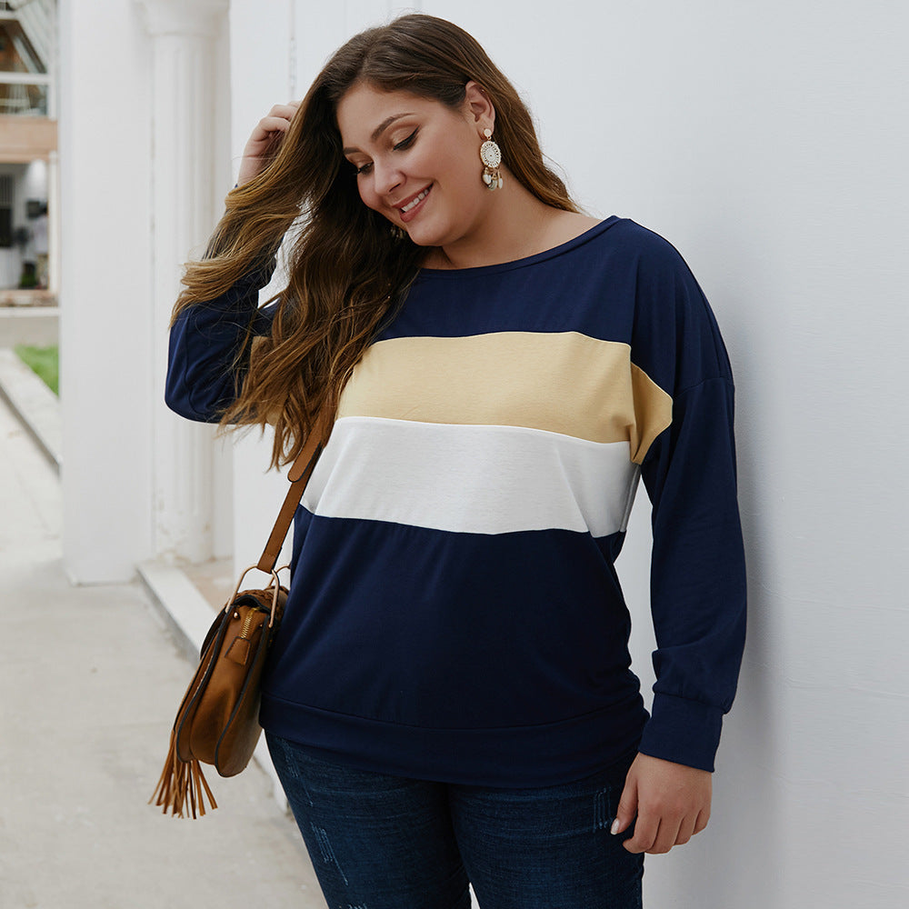 Plus size woman wearing casual plus size tops for women in navy blue with beige and white stripes