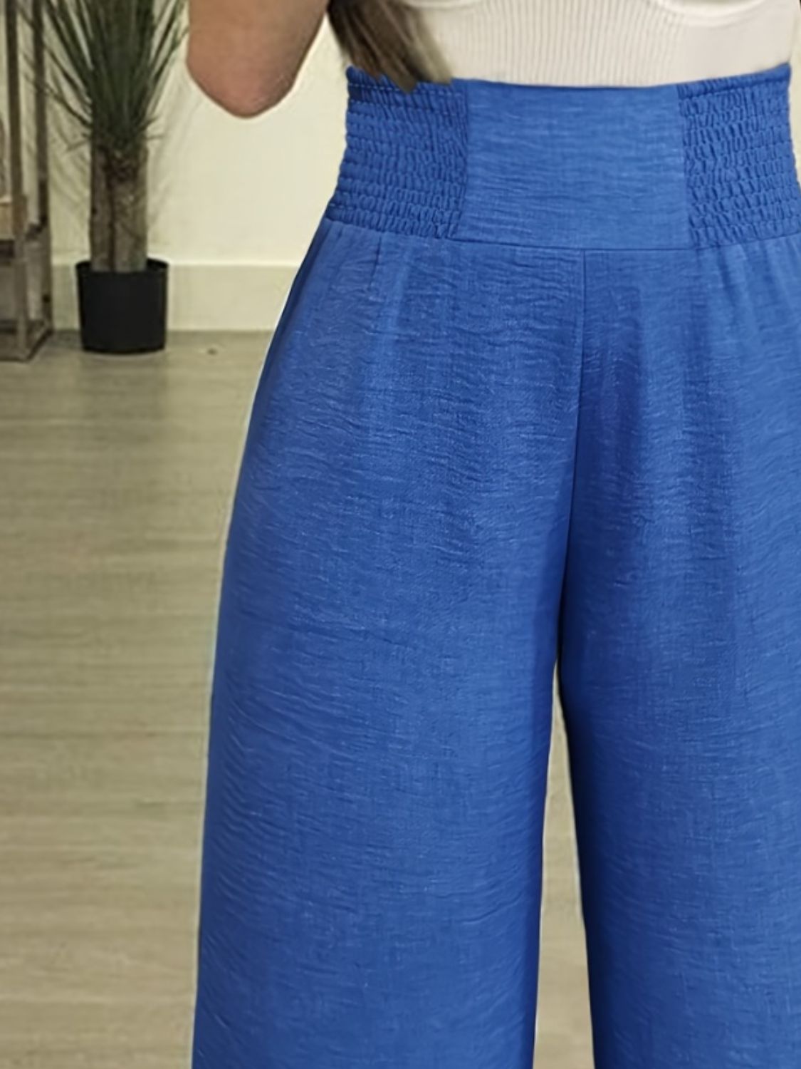 Blue comfortable high waisted pants for women with a textured fabric and elastic waistband
