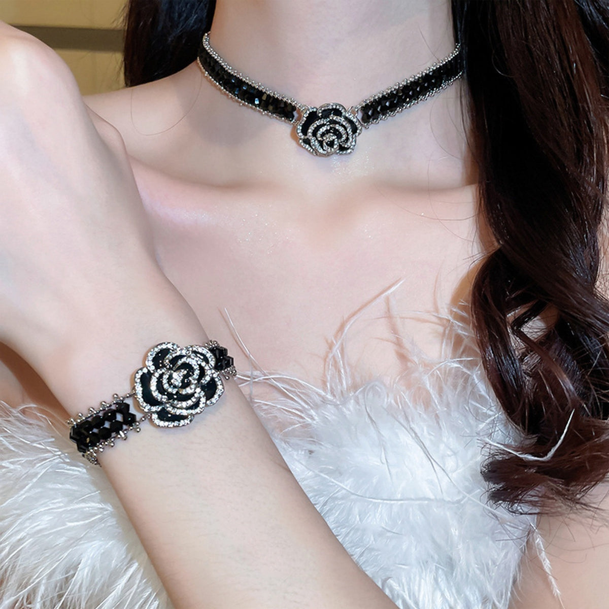 Copper rhinestone flower bracelet worn on wrist with matching rhinestone flower choker necklace