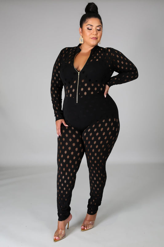 Black curvy women zip front jumpsuit with sheer patterned fabric and long sleeves