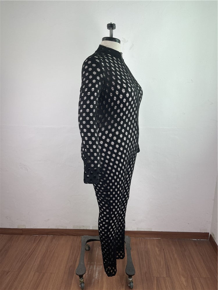 Black and white curvy women zip front jumpsuit on mannequin with patterned design and long sleeves