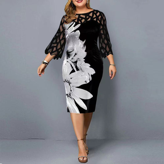 Elegant plus size cocktail dress featuring black mesh sleeves and a large white floral print design