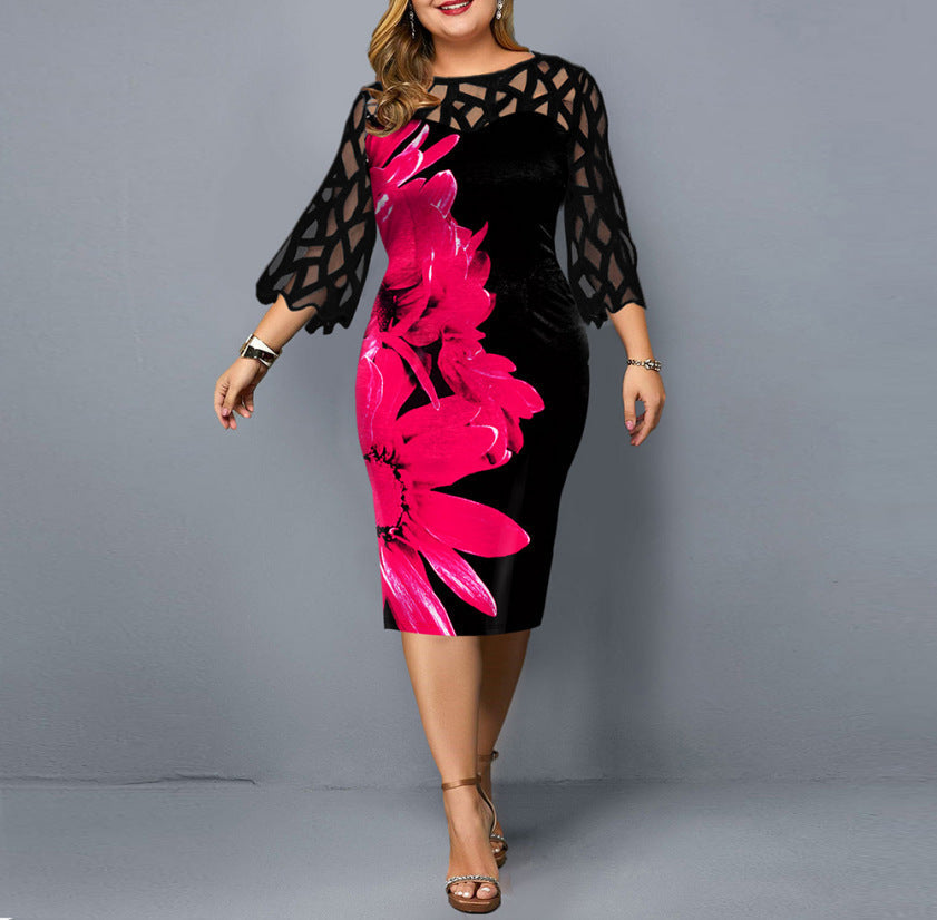 Elegant plus size cocktail dress with black mesh sleeves and large pink floral design on bodycon silhouette