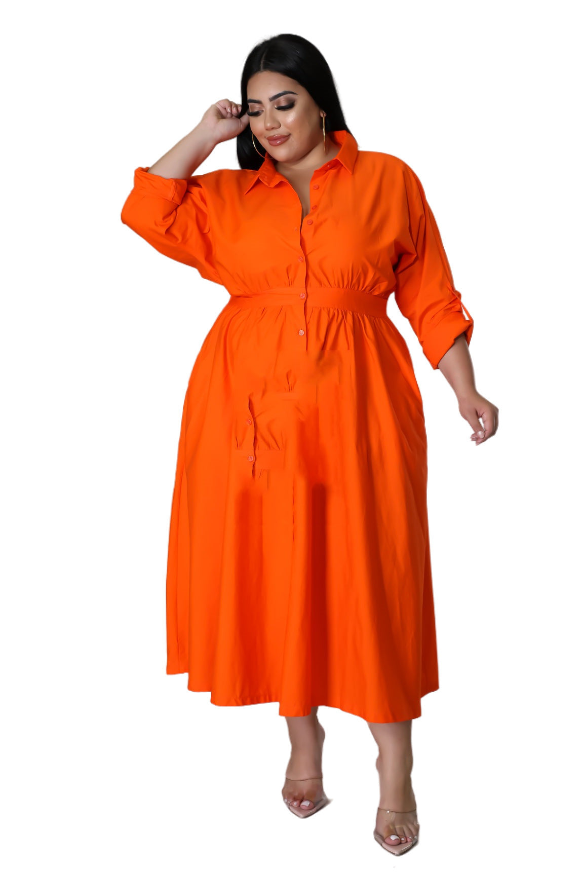 Plus size woman wearing a bright orange button-up midi dress showcasing fashionable plus size dresses for women