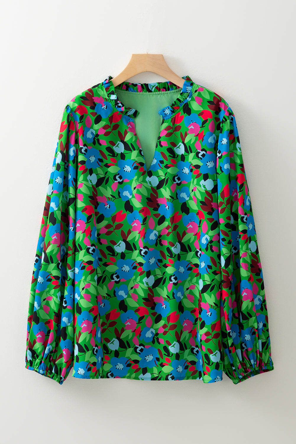 Floral print plus size blouse with vibrant blue and pink flowers on green background by kjplussizefashion