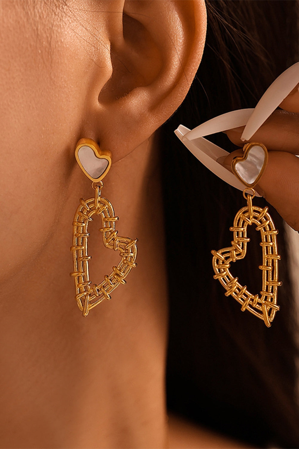 Trendsi stainless steel heart jewelry set featuring gold-tone woven heart earrings with white enamel tops