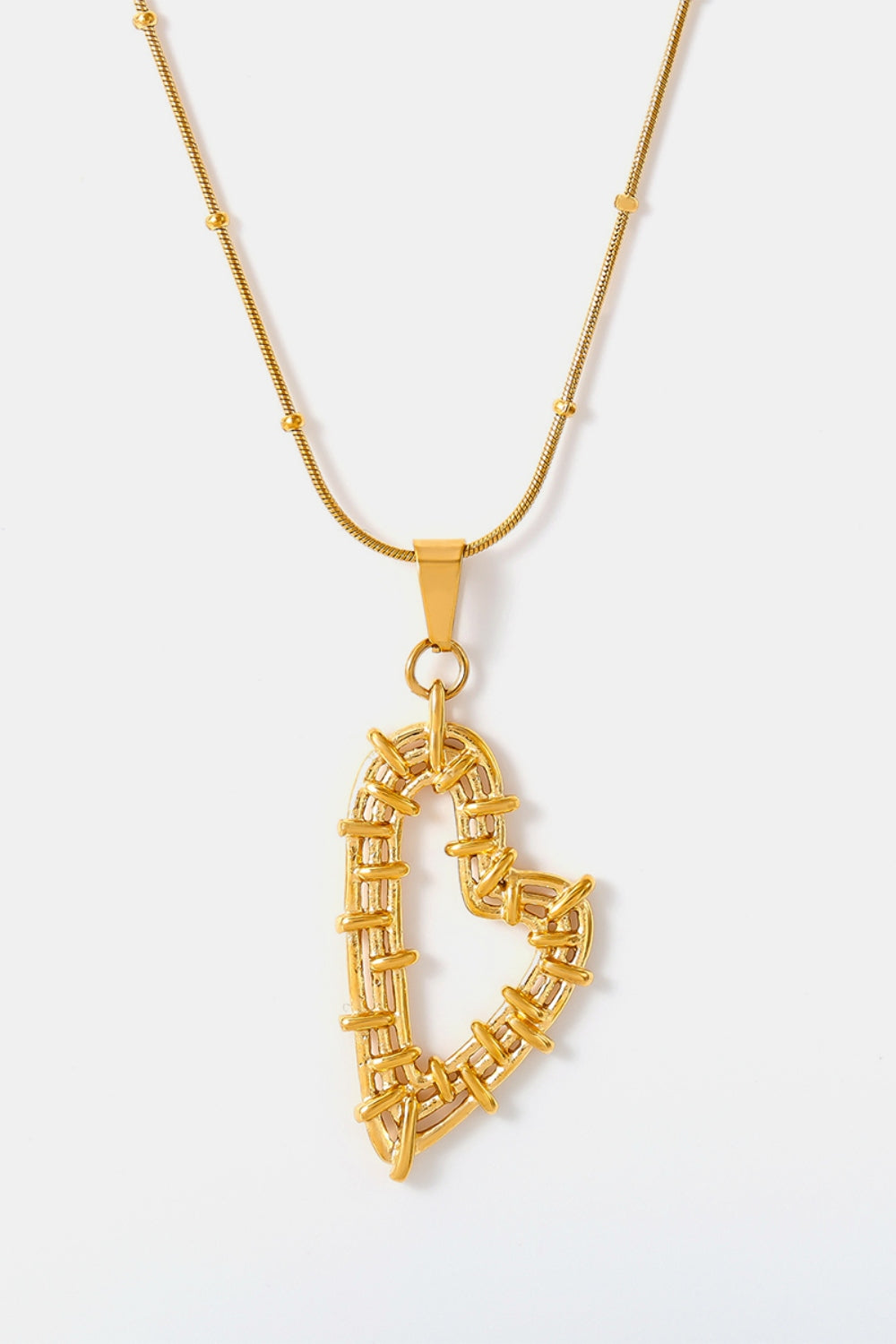 Gold tone stainless steel heart jewelry set pendant necklace with intricate wrapped design