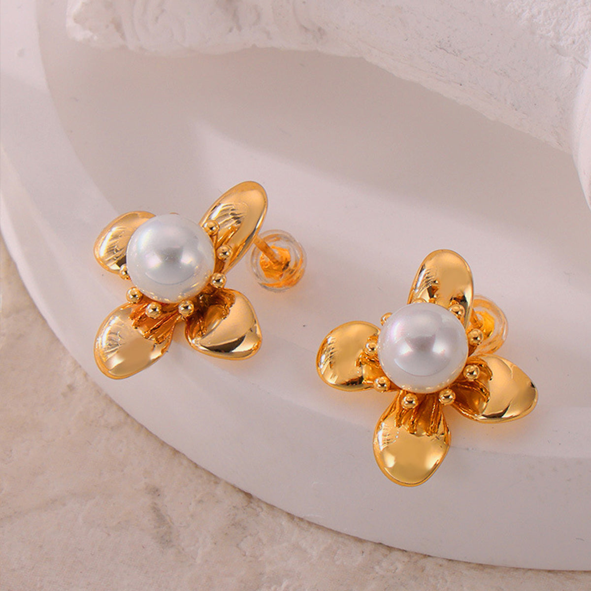 Trendsi synthetic pearl titanium earrings with gold floral design and round pearl center