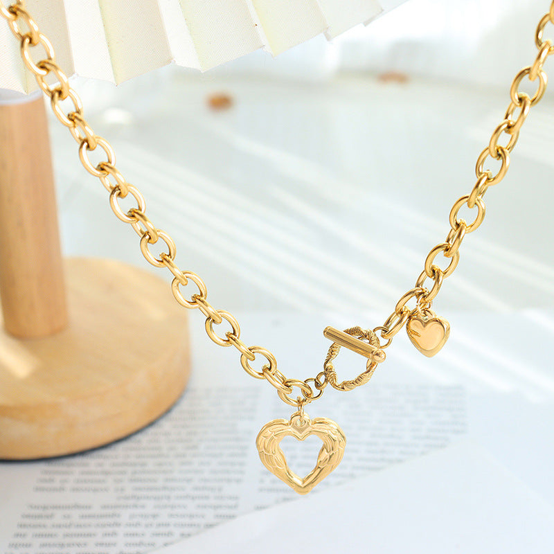 Gold titanium steel heart necklace with chain links and toggle clasp by Trendsi