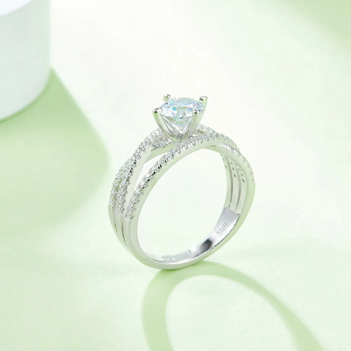 Elegant 1 carat moissanite solitaire ring with a sparkling center stone and diamond-accented split shank