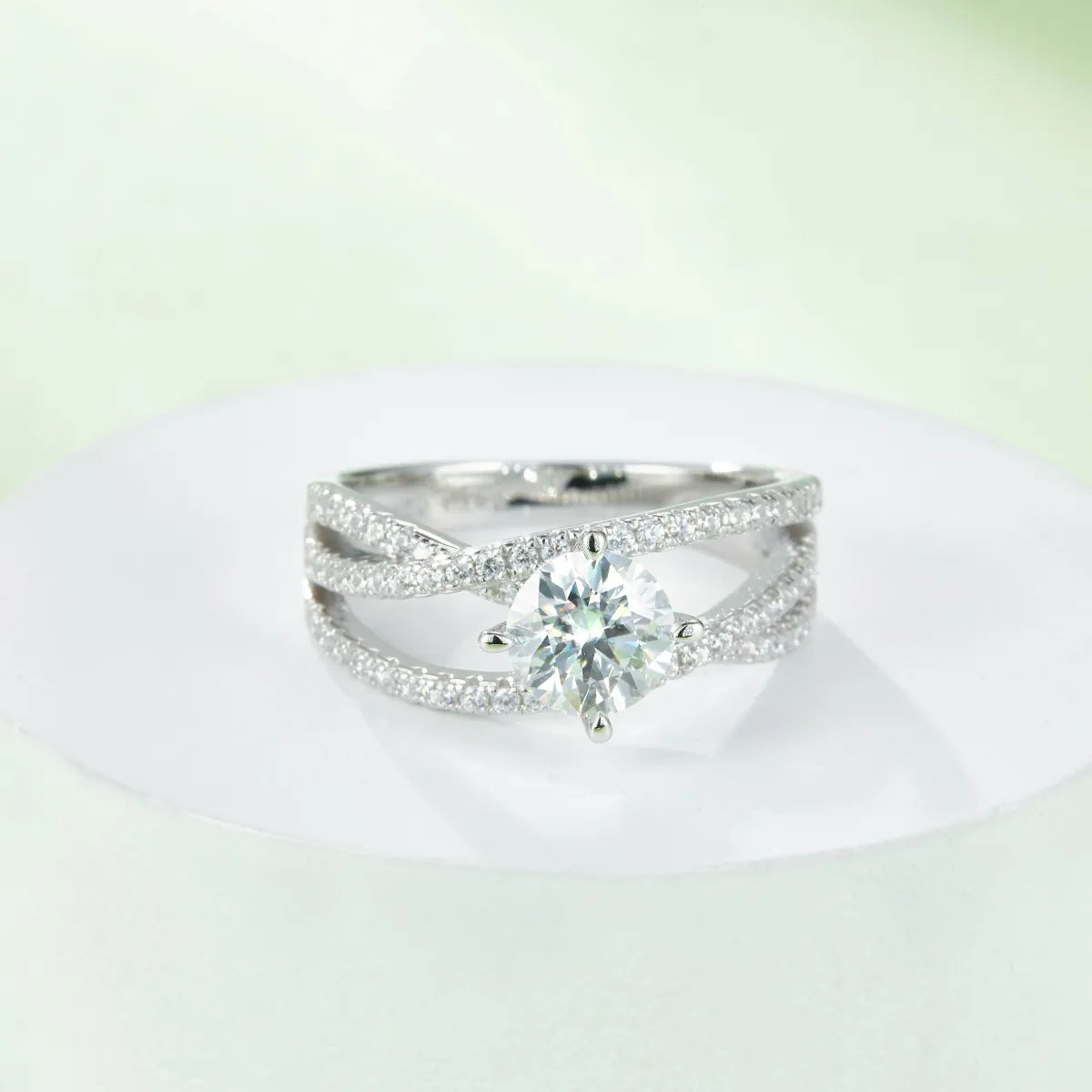 1 carat moissanite solitaire ring with twisted double band encrusted with small diamonds