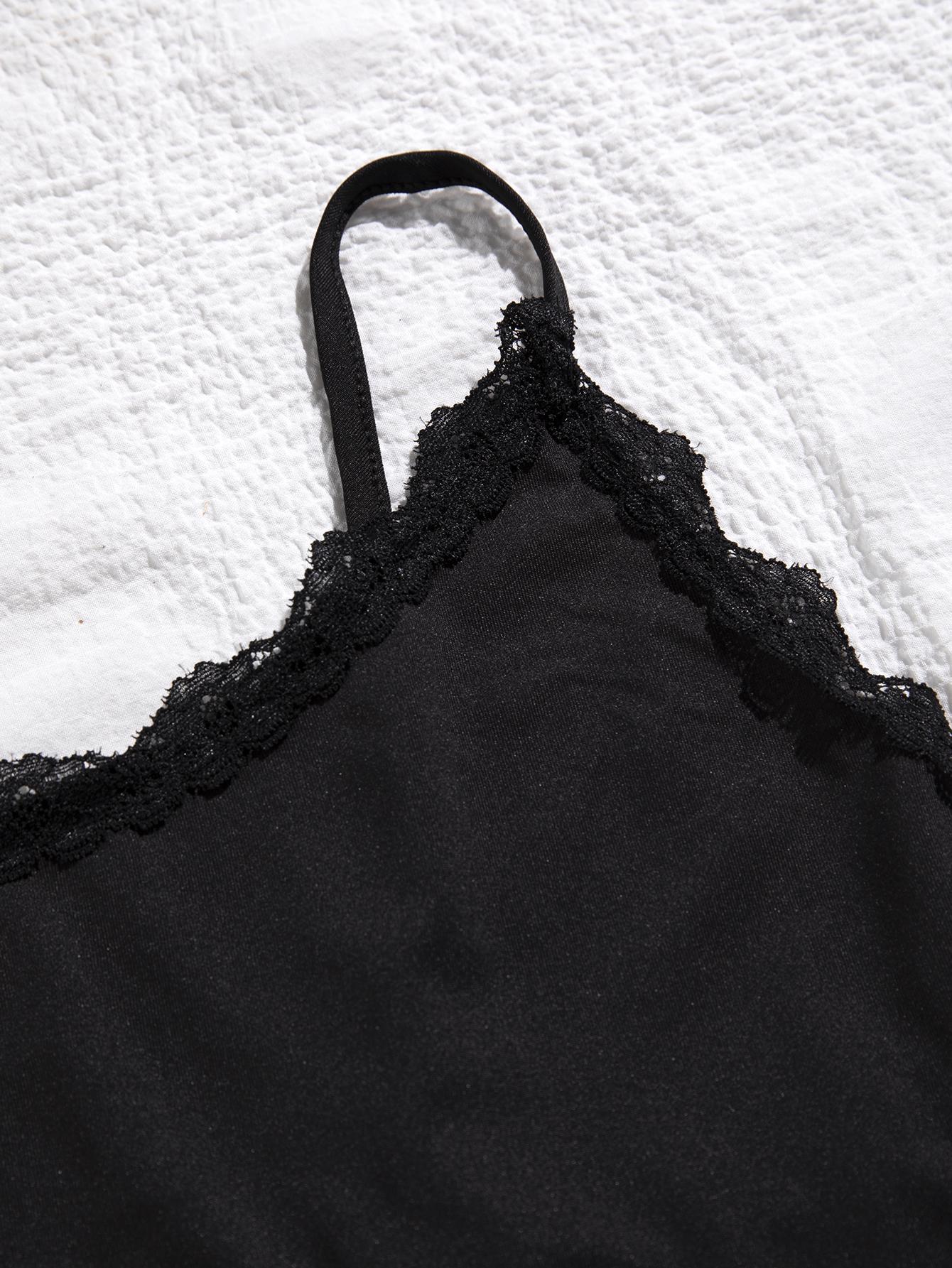 Close-up of black lace trim plus size sleepwear strap and lace detail on soft fabric