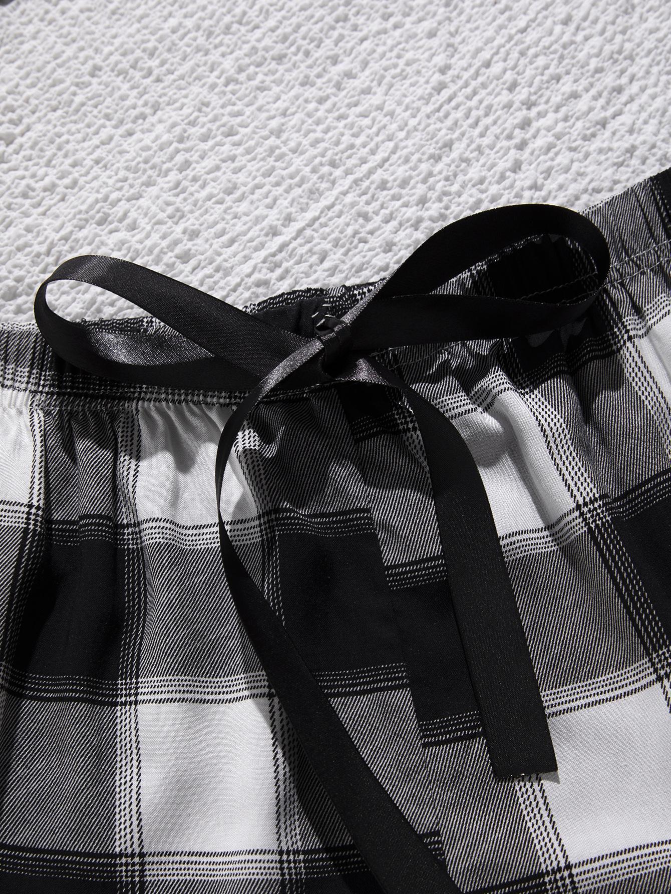Close-up of lace trim plus size sleepwear black and white plaid fabric with black ribbon detail