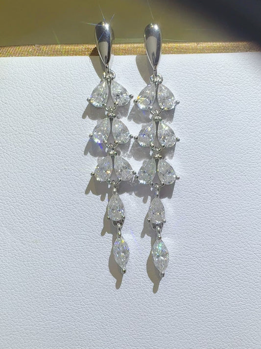 Trendsi moissanite bar earrings featuring multiple sparkling pear-shaped stones in a dangling design