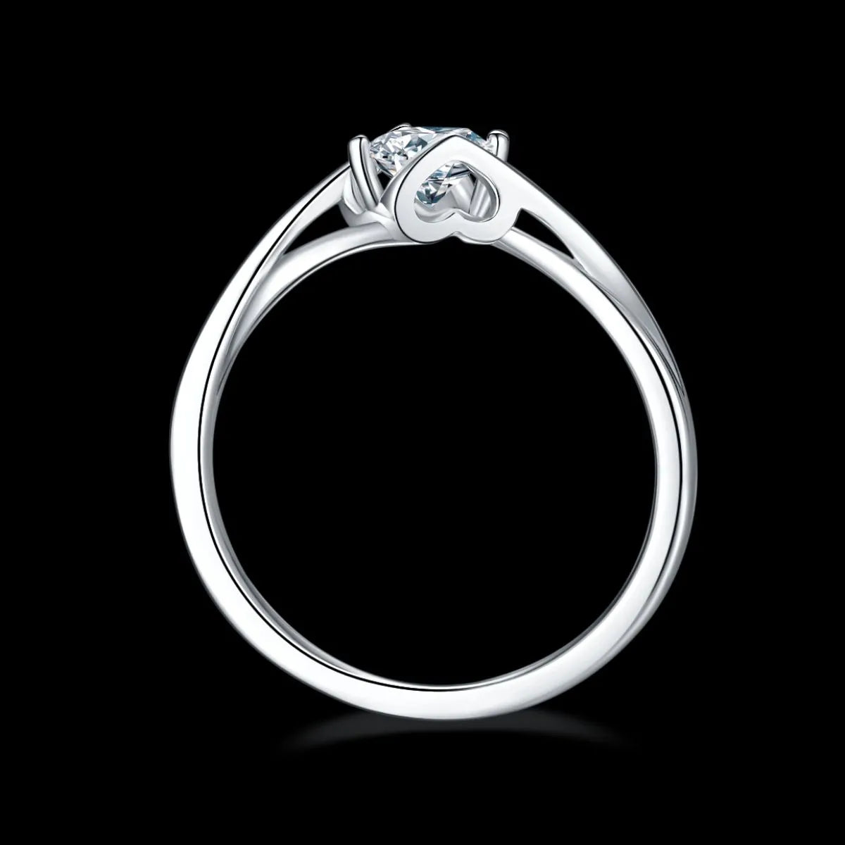 Elegant moissanite sterling silver ring with a heart-shaped detail and sparkling center stone