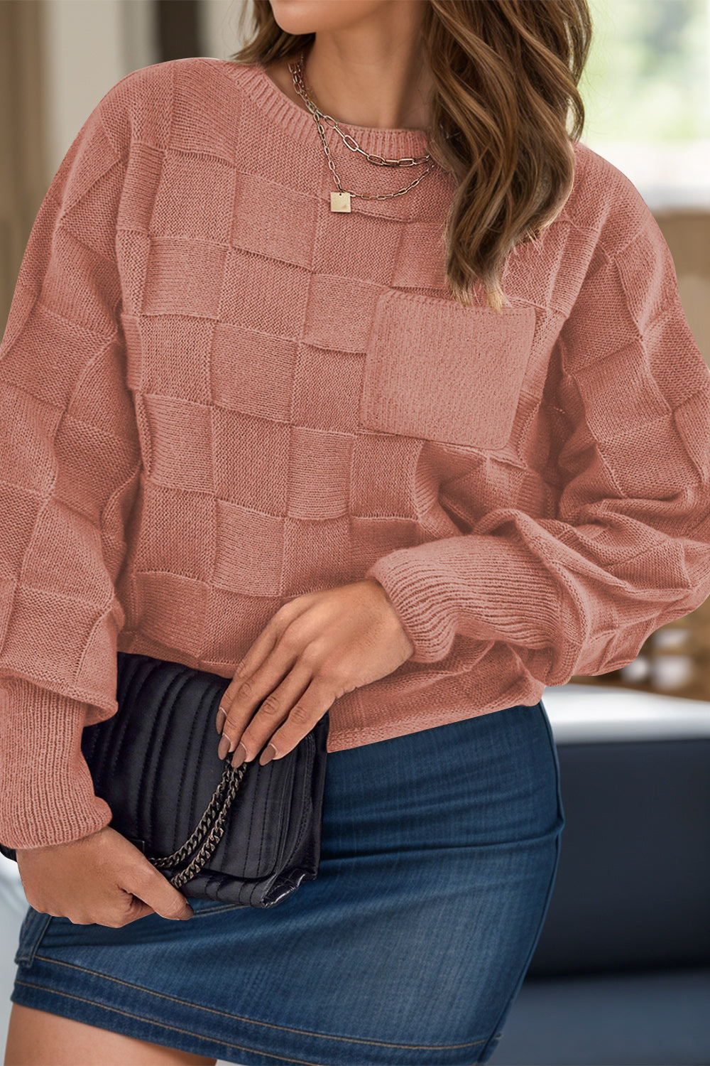 Plus size beige sweater for women with textured square pattern and long sleeves styled with denim skirt
