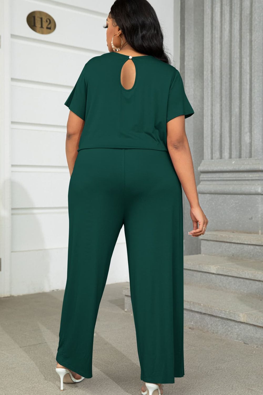 Plus size casual jumpsuit in dark green with short sleeves and wide-leg pants from Trendsi