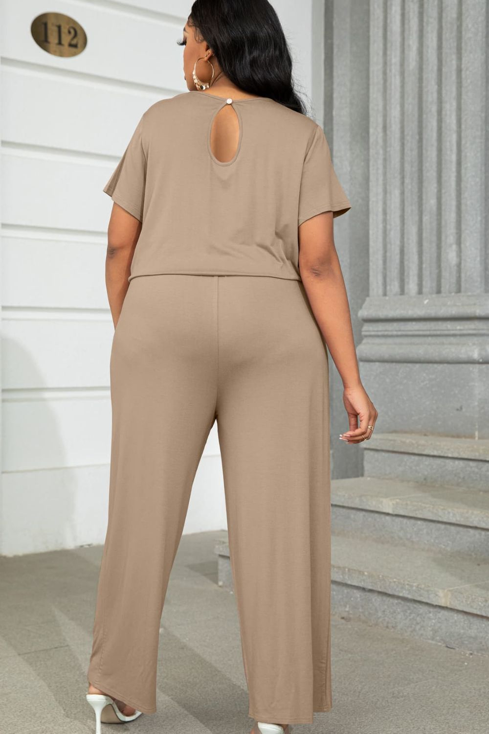 Plus size casual jumpsuit in beige with short sleeves and keyhole back detail from Trendsi