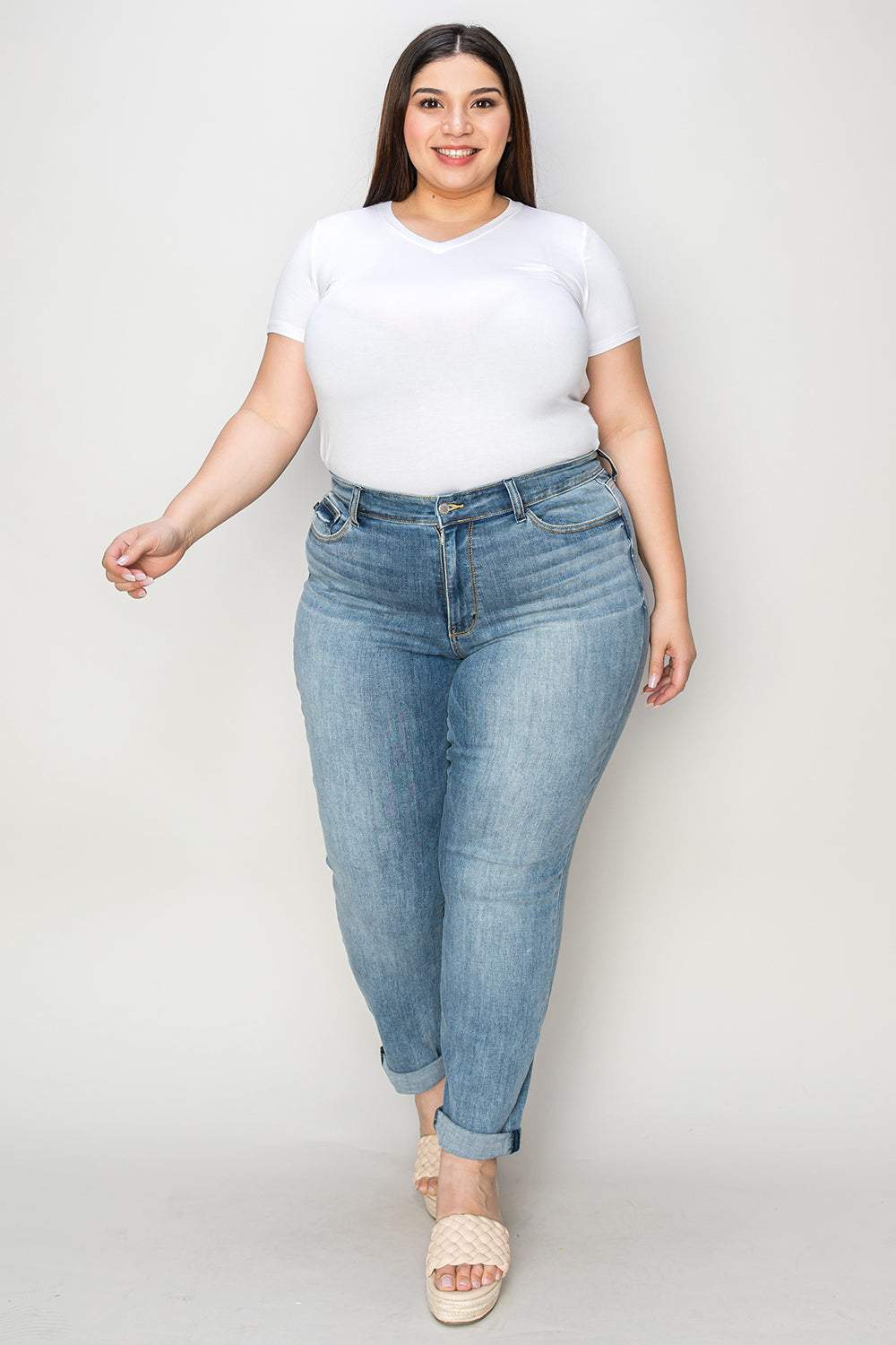Plus size model wearing Trendsi plus size cuffed hem jeans with a white t-shirt and sandals