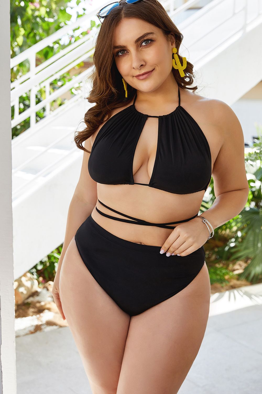 Trendsi plus size cutout bikini set in black with halter neck and wrap-around waist straps