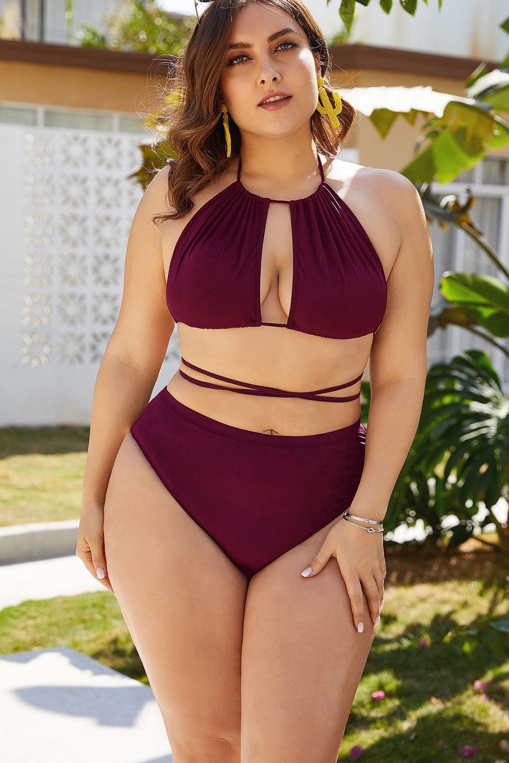 Plus size cutout bikini set in deep burgundy with halter neck and wrap-around straps by Trendsi