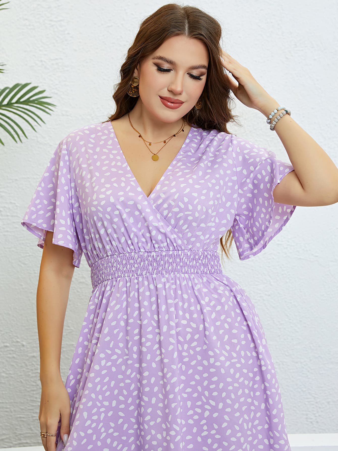 Trendsi plus size floral smocked dress in lavender with white petal pattern and flutter sleeves