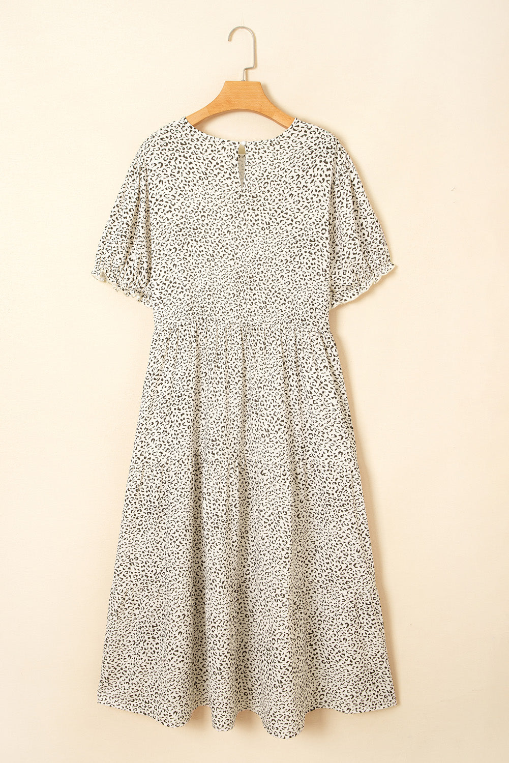 kjplussizefashion plus size leopard print dress midi length with short sleeves on hanger