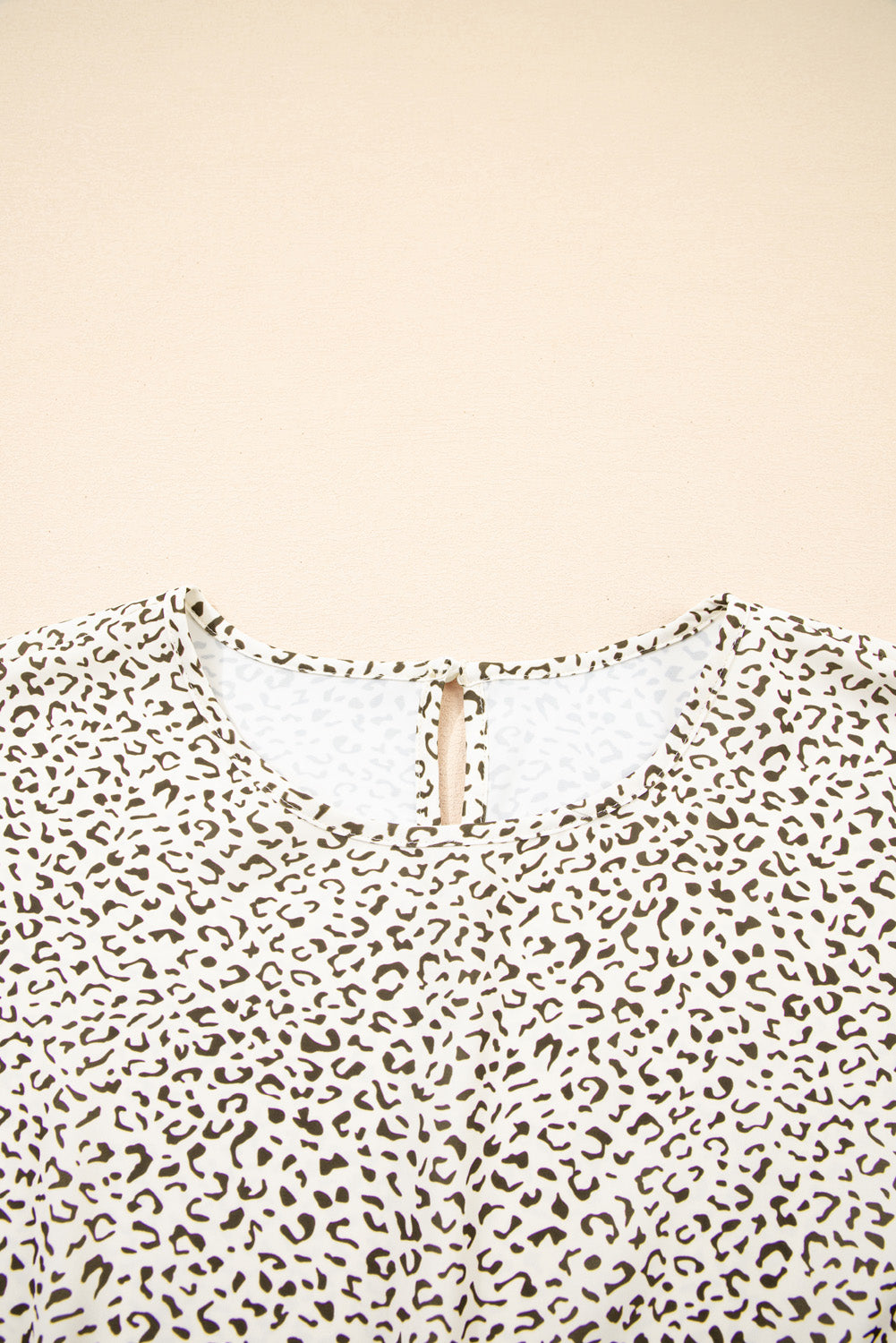 Close-up of kjplussizefashion plus size leopard print dress neckline with keyhole detail