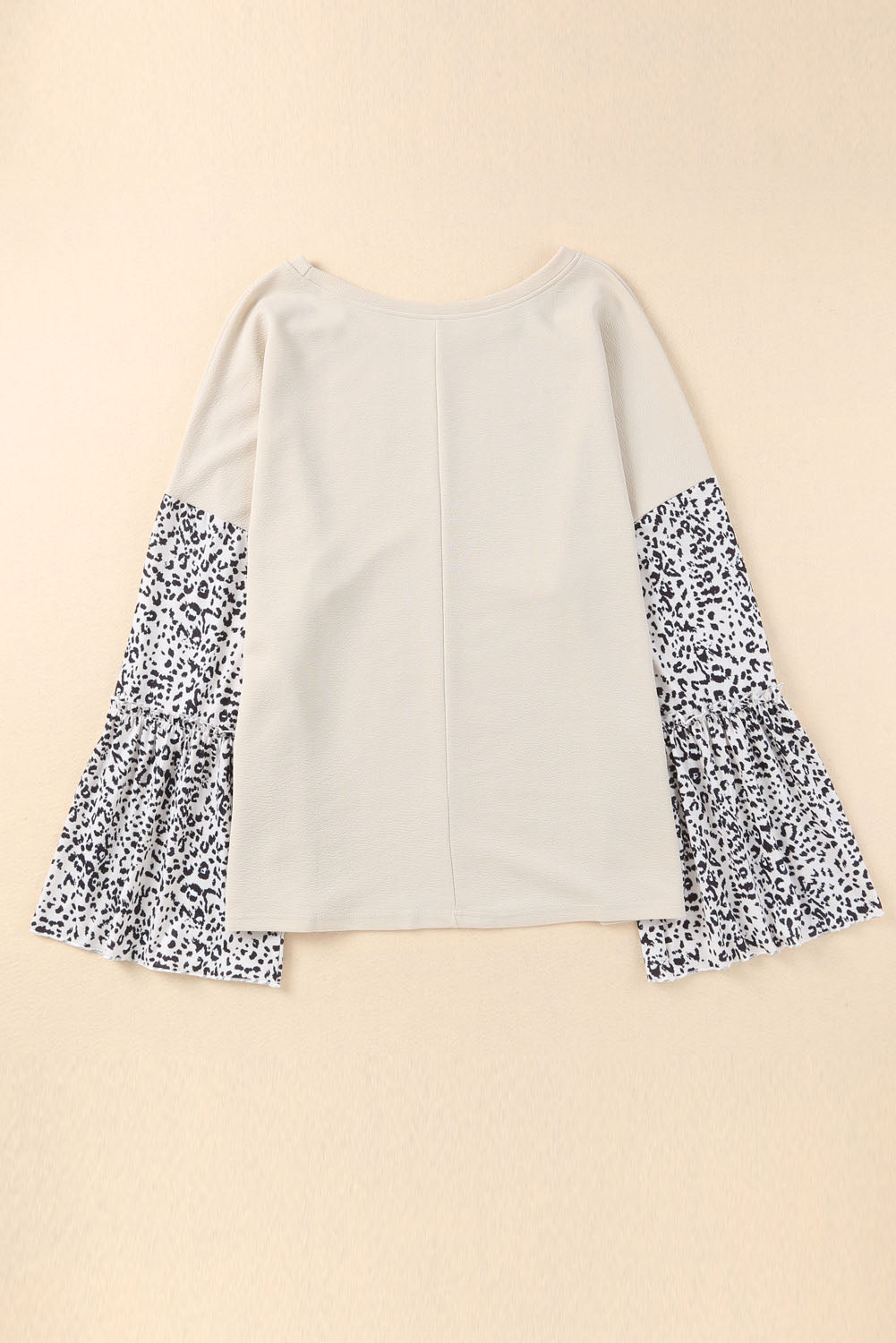 Plus size leopard print top with bell sleeves and crew neckline in soft fabric