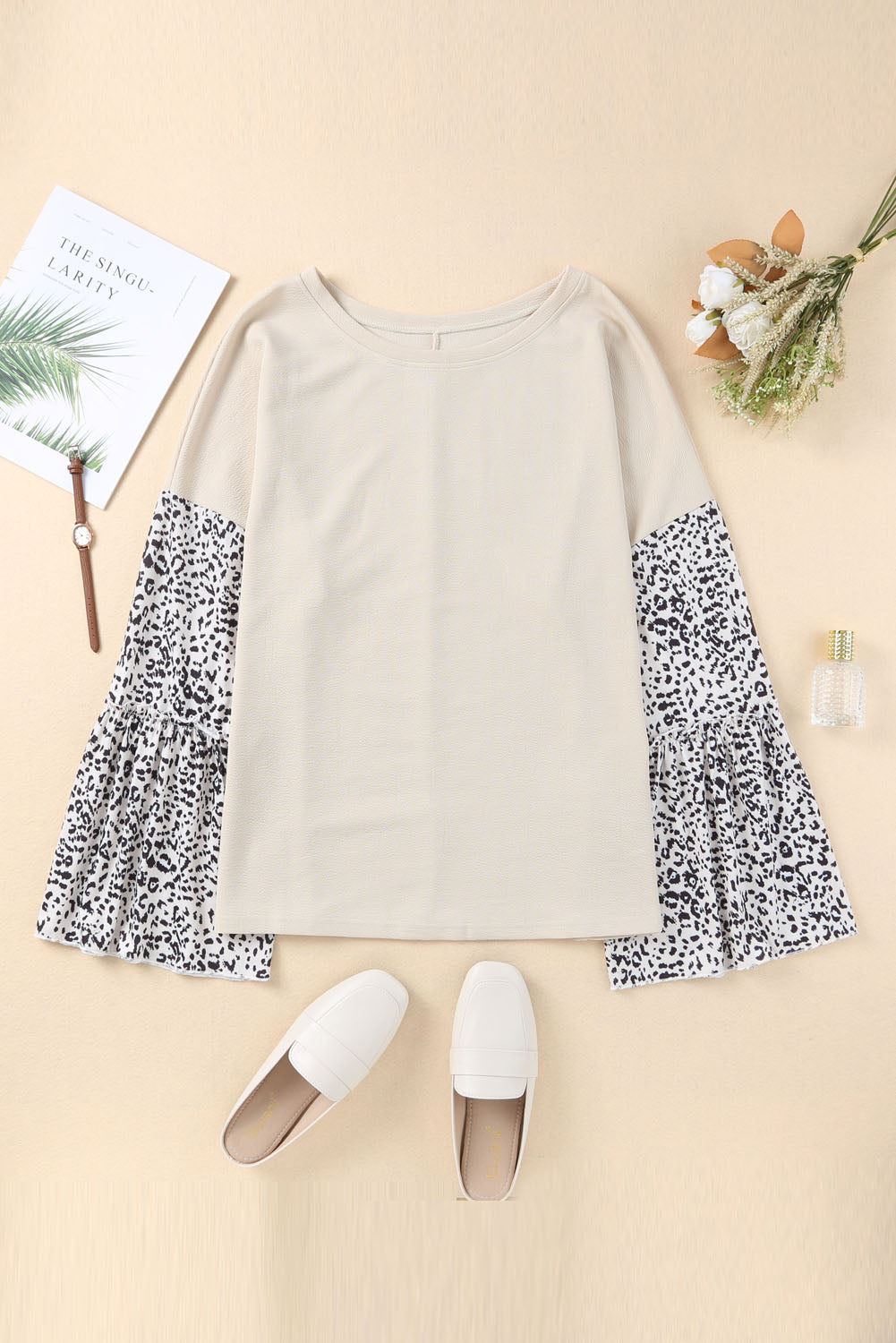 Plus size leopard print top with bell sleeves and crew neckline, stylish and comfortable for casual or polished looks