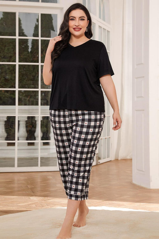 Plus size lounge set for women with black short sleeve top and black and white checkered pants