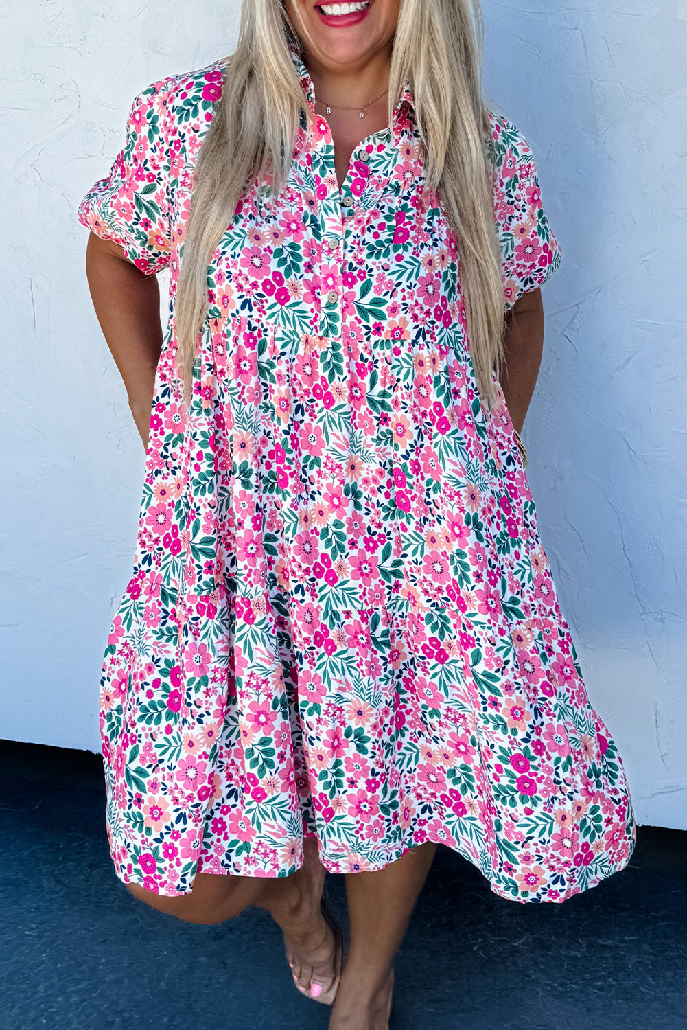Plus size pink floral A-line dress with short puff sleeves and half button front, casual mini length.