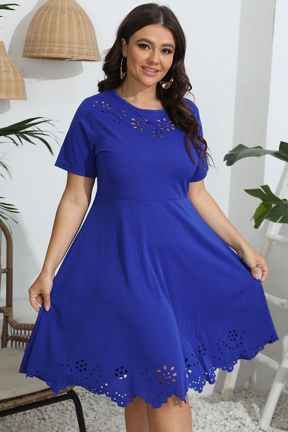 Plus size round neck openwork dress in blue with short sleeves and floral cutout details
