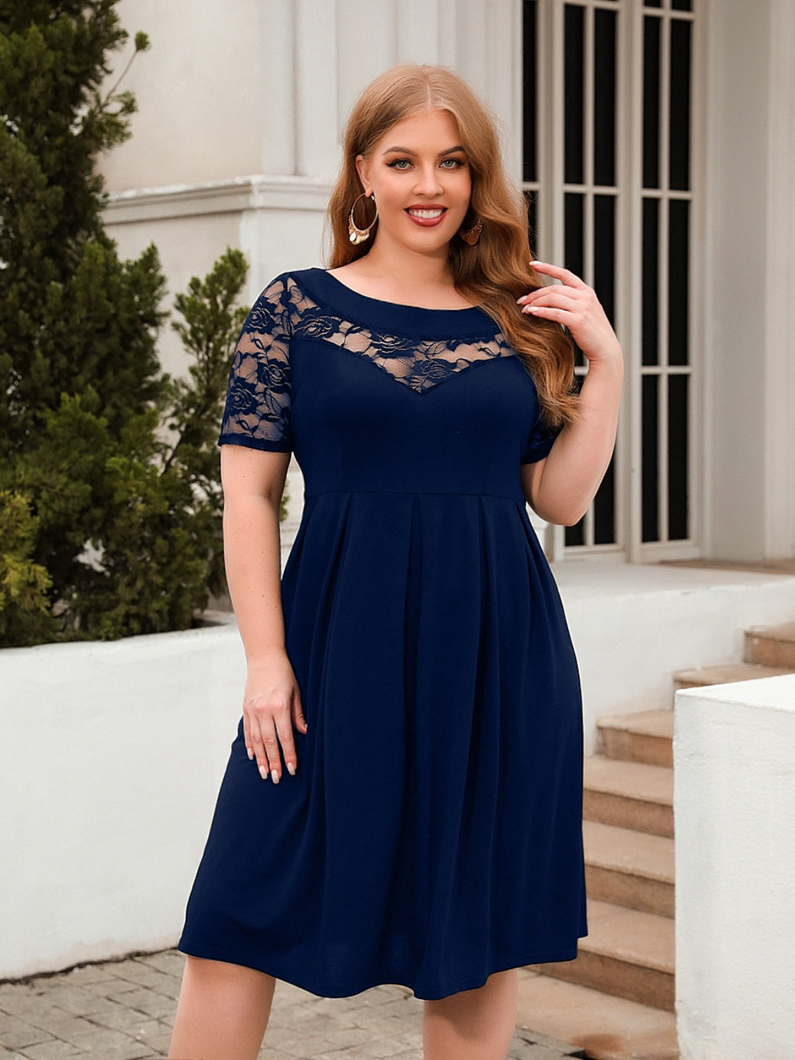 Trendsi plus size ruched dress in navy blue with lace short sleeves and a fitted bodice