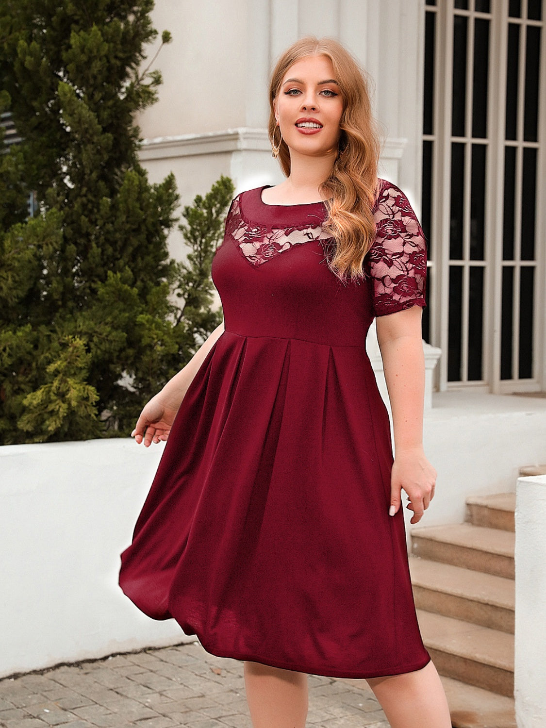 Trendsi plus size ruched dress in burgundy with lace sleeves and a flattering fit for special occasions