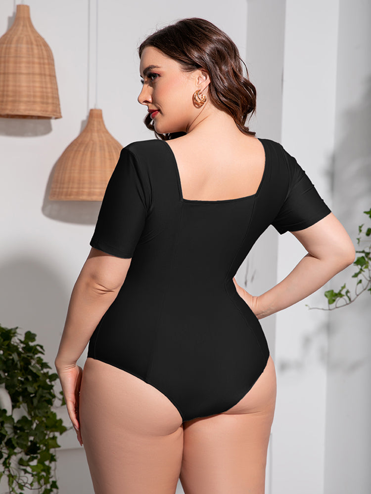Trendsi plus size scoop neck swimsuit in black with short sleeves and square back design