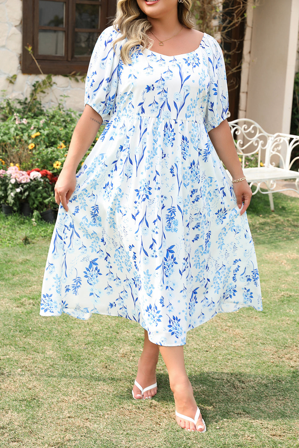 Plus size sky blue floral midi dress with puff sleeves and a flowy silhouette from kjplussizefashion