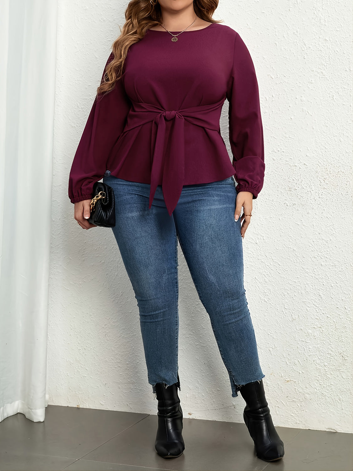 Trendsi plus size tie front blouse in deep purple with long sleeves styled with jeans and black boots