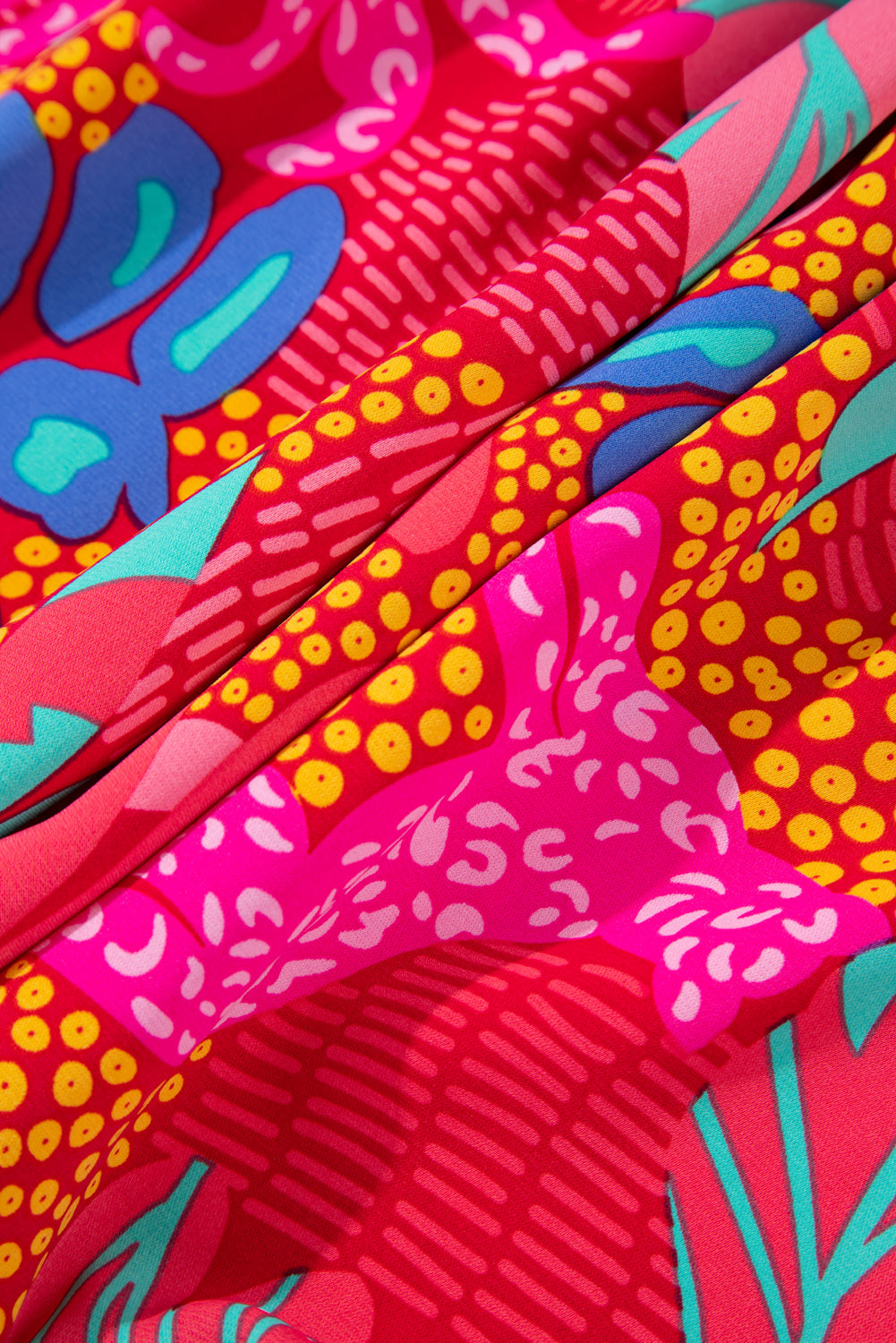 Close-up of colorful fabric pattern on kjplussizefashion plus size tropical print mini dress