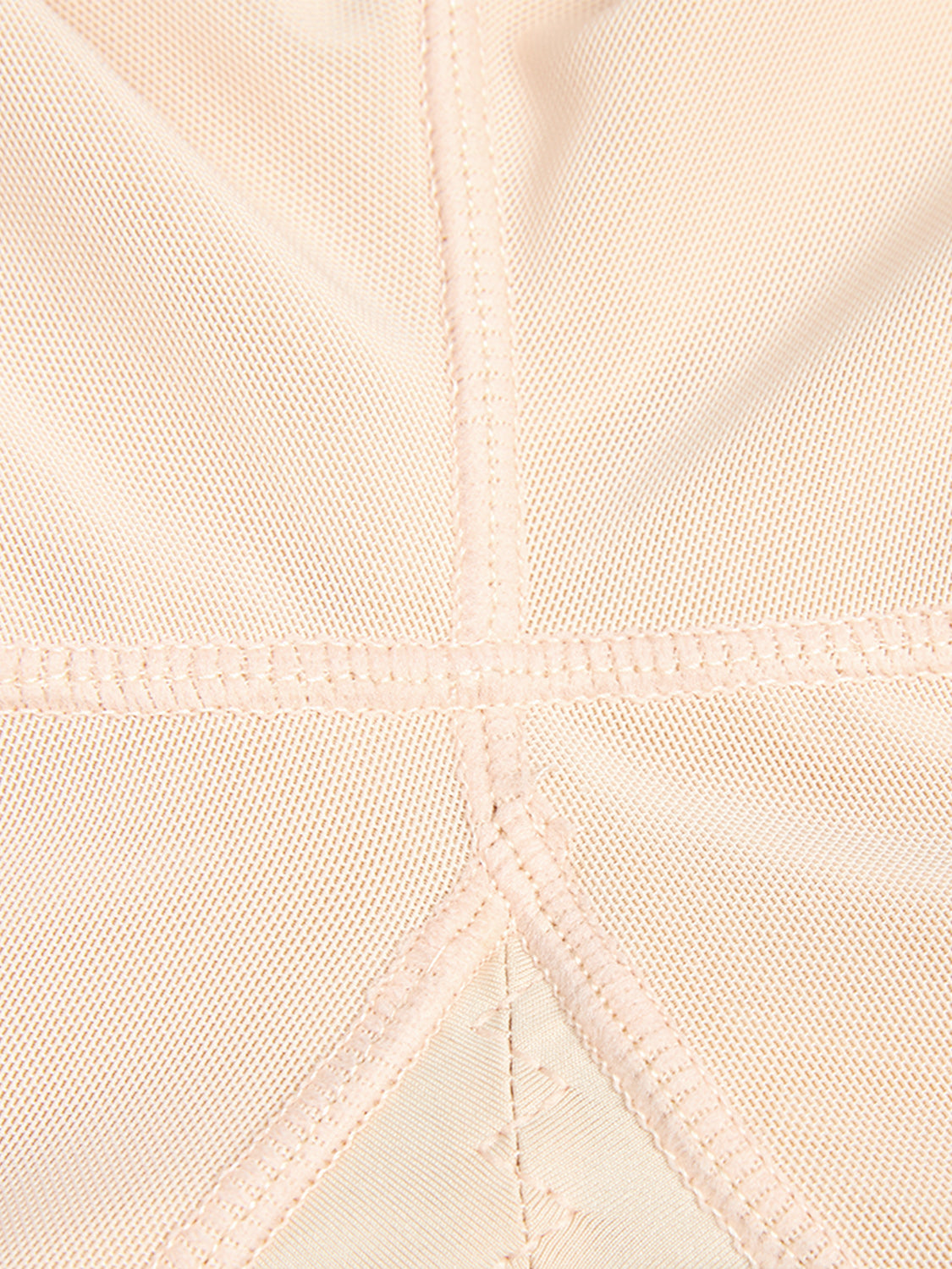 Close-up detail of beige plus size zip up shapewear fabric and stitching by Trendsi