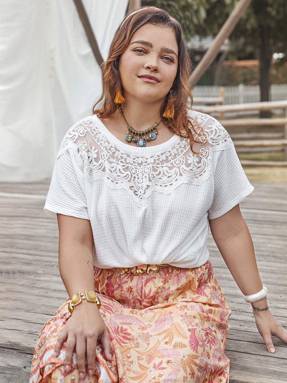Trendsi white round neck short sleeve plus size blouse with lace detail worn by woman